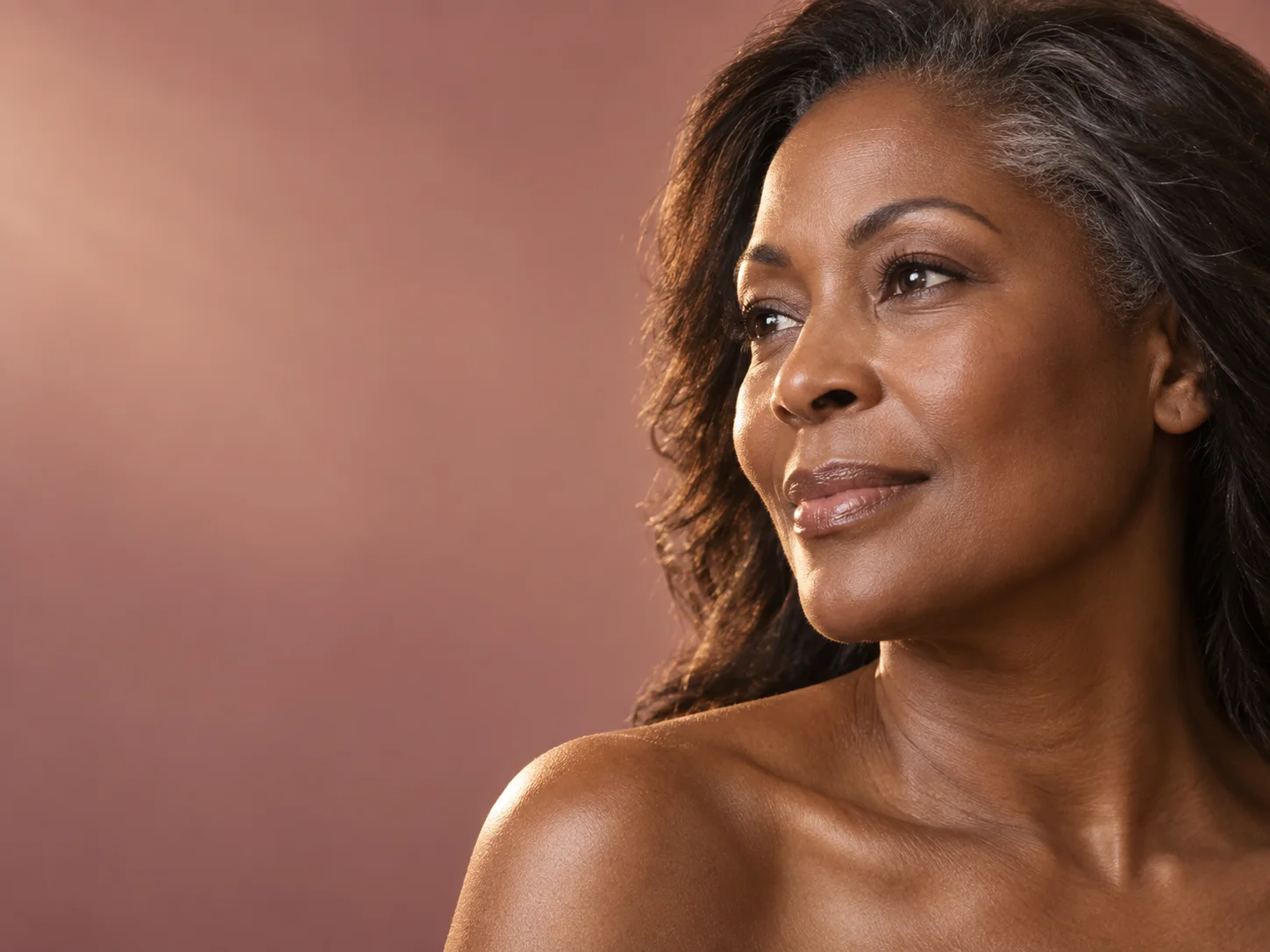 Editorial portrait highlighting natural cheek and facial contour